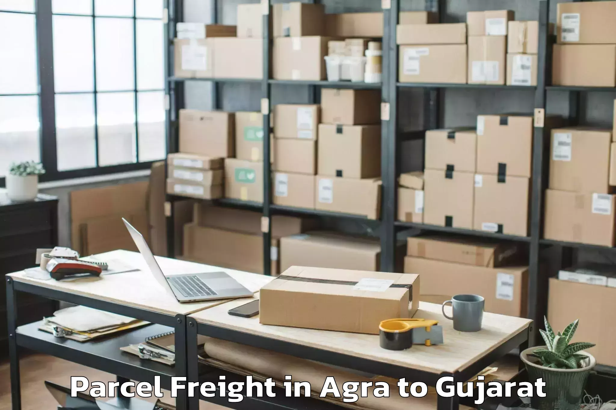 Easy Agra to Keshod Airport Ixk Parcel Freight Booking